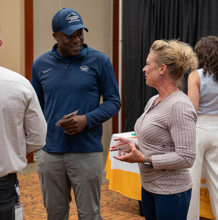 Colorado Springs Health and Fitness Expo founder Sandi Griffin talks with Mayor Yemi Mobolade.