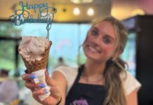 A worker holds up a Happy Birthday cone at Josh and John's, winner of our People's Choice Best Ice Cream in Colorado Springs.