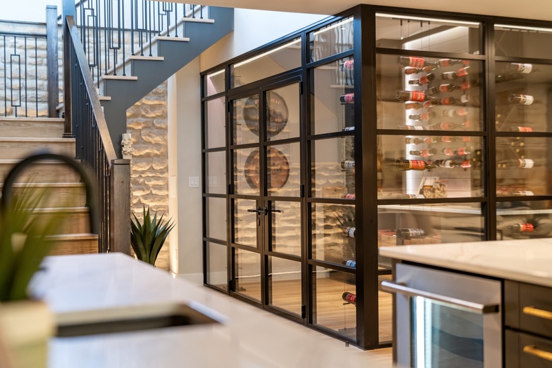 A glass wine cellar in a home on the 2026 Colorado Springs Parade of Homes.