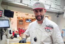 Slice 420 Express Nears Opening Downtown Slice 420 owner Christian Patriarca serves a giant pizza.