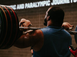 Behind the Scenes at the U.S. Olympic & Paralympic Training Center Team USA weightlifter Aaron Williams lifts heavy weights at the U.S. Olympic and Paralympic Training Center in Colorado Springs.