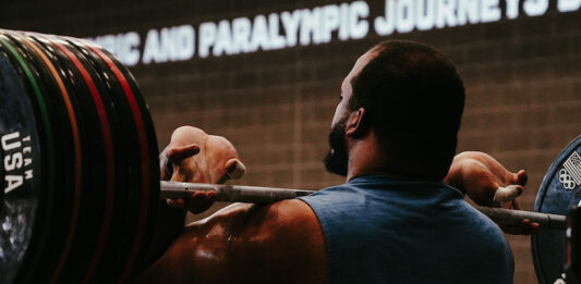 Behind the Scenes at the U.S. Olympic & Paralympic Training Center Team USA weightlifter Aaron Williams lifts heavy weights at the U.S. Olympic and Paralympic Training Center in Colorado Springs.