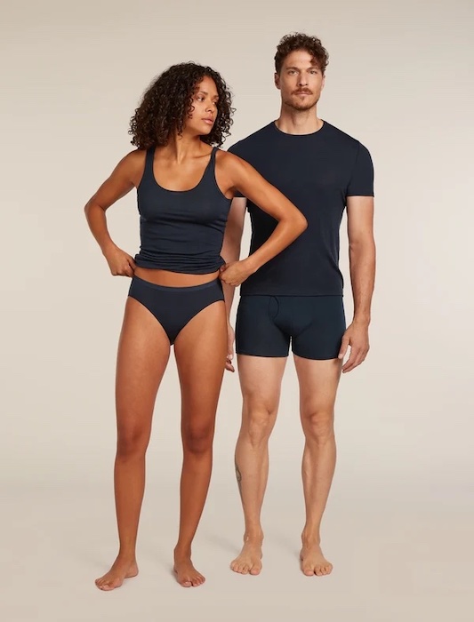 A couple wears Icebreaker Merino 150 underwear in a men's Anatomica Boxer and a women's Siren Hipkini.