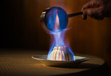 Colorado Springs Has Its First Michelin Award Winners Flambeed Baked Alaska prepared tableside at The Penrose Room at The Broadmoor, one of the first Colorado Springs Michelin awards.