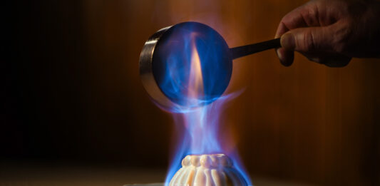 Colorado Springs Has Its First Michelin Award Winners Flambeed Baked Alaska prepared tableside at The Penrose Room at The Broadmoor, one of the first Colorado Springs Michelin awards.
