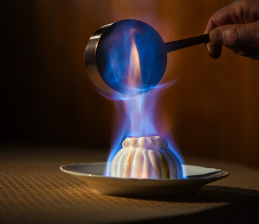 Colorado Springs Has Its First Michelin Award Winners Flambeed Baked Alaska prepared tableside at The Penrose Room at The Broadmoor, one of the first Colorado Springs Michelin awards.