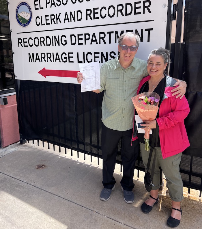 Laura Eurich and Todd show off their marriage license.