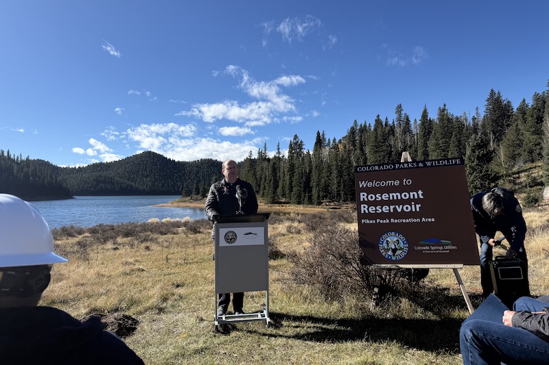 Gov. Jared Polis speaks at a groundbreaking for the new Rosemont Reservoir campground near Colorado Springs and Pikes Peak. 